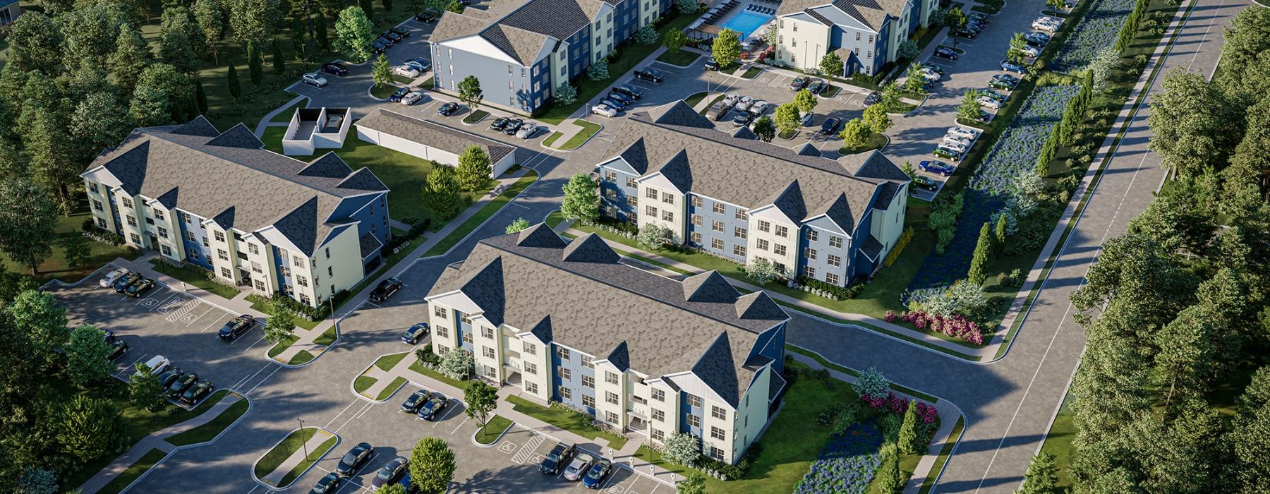 a large property with many buildings surrounded by trees