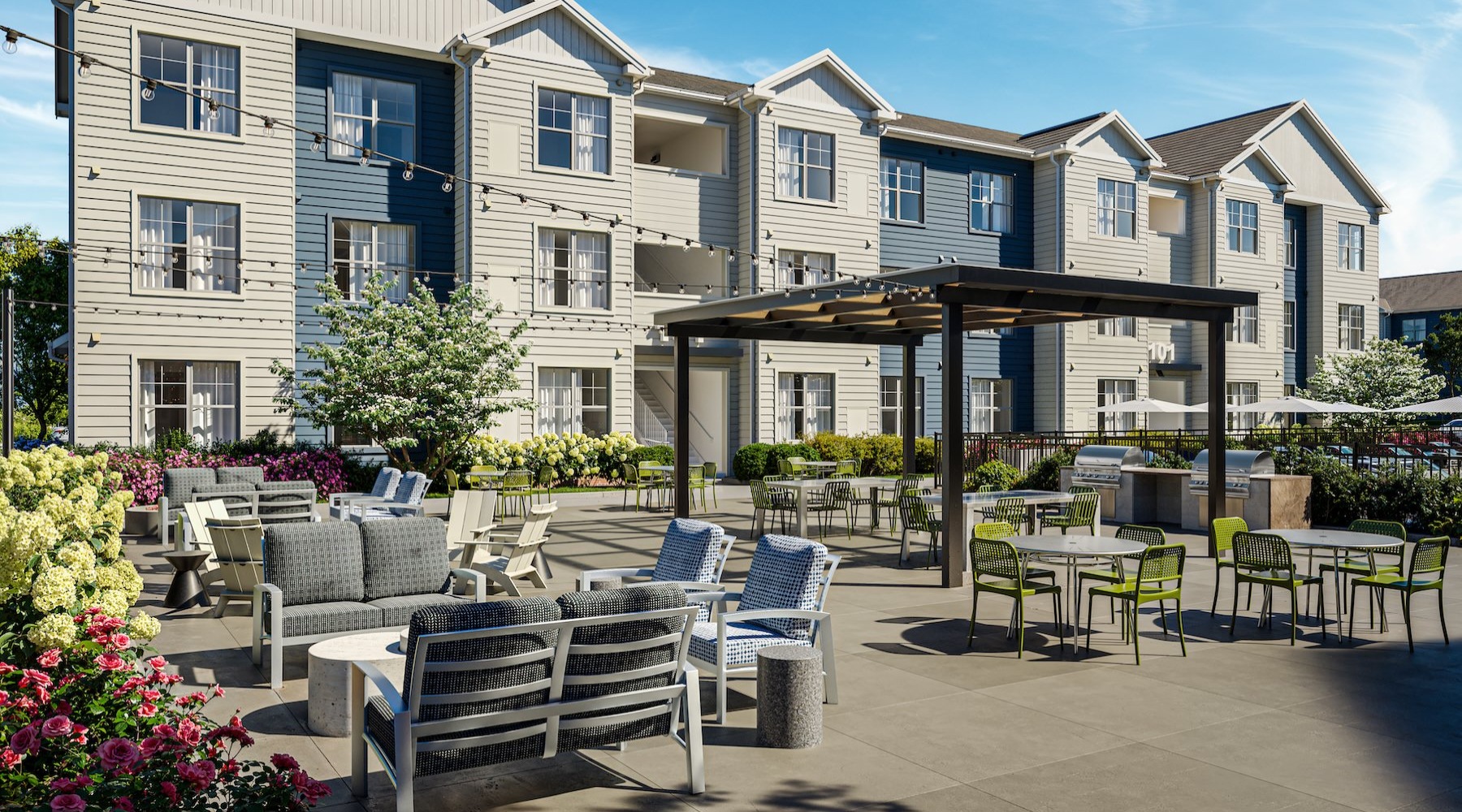 an outdoor area with tables, chairs and landscaping