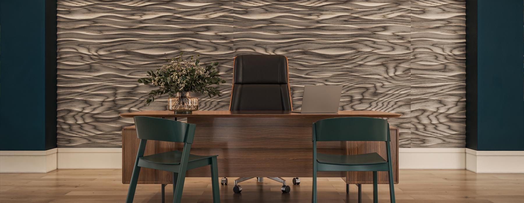 a room with a table chairs and a laptop on it