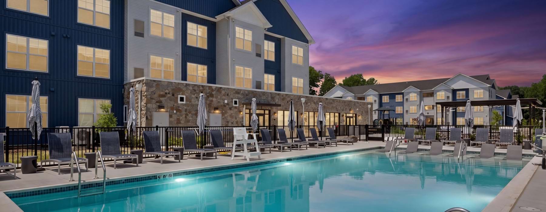 Serene pool courtyard at dusk at The Randall apartments in Woodbury Heights, New Jersey.