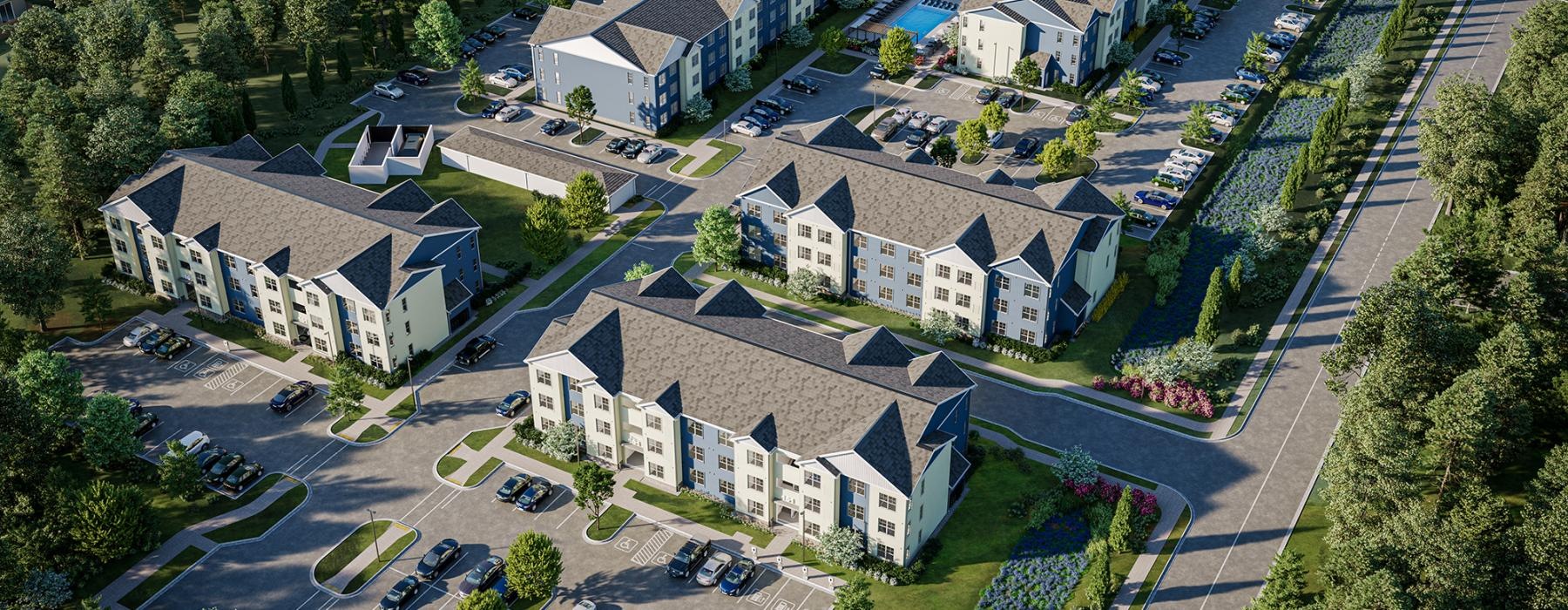 a large property with many buildings surrounded by trees